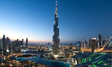 The Burj Khalifa, the world's tallest building, towers majestically against a clear blue sky.
